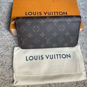 Louis Vuitton zippy wallet in monogram.